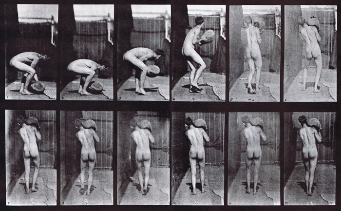 Rear view of nude male lifting a 75 pound stone on shoulder animation reference using muybridge plate 397 from animal locomotion